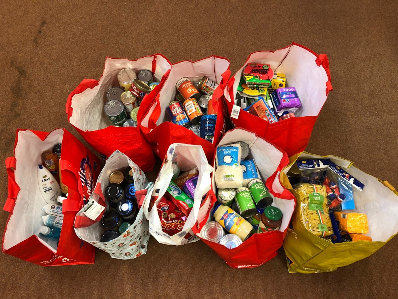 connect-for-health-staff-fill-trolley-for-foodbank-compass